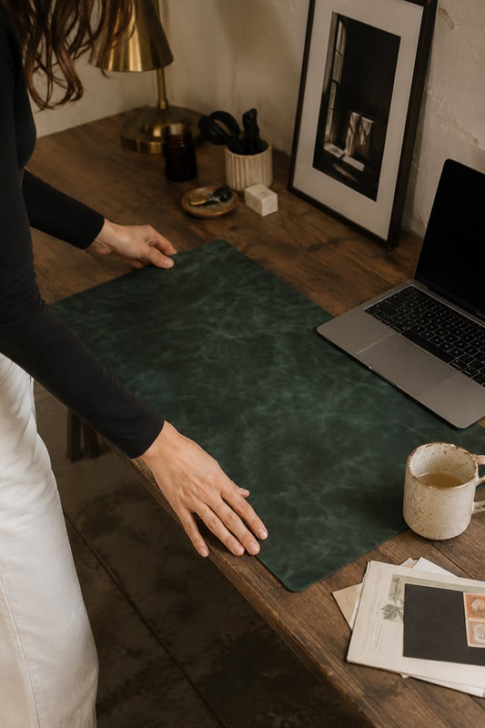 Leather Desk Mat, Forest Green, styled with a brass lamp and mug
