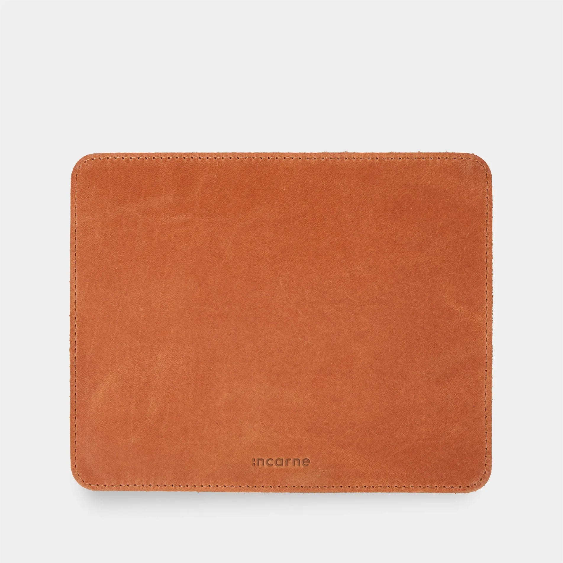 Cognac leather mousepad on desk, INCARNE